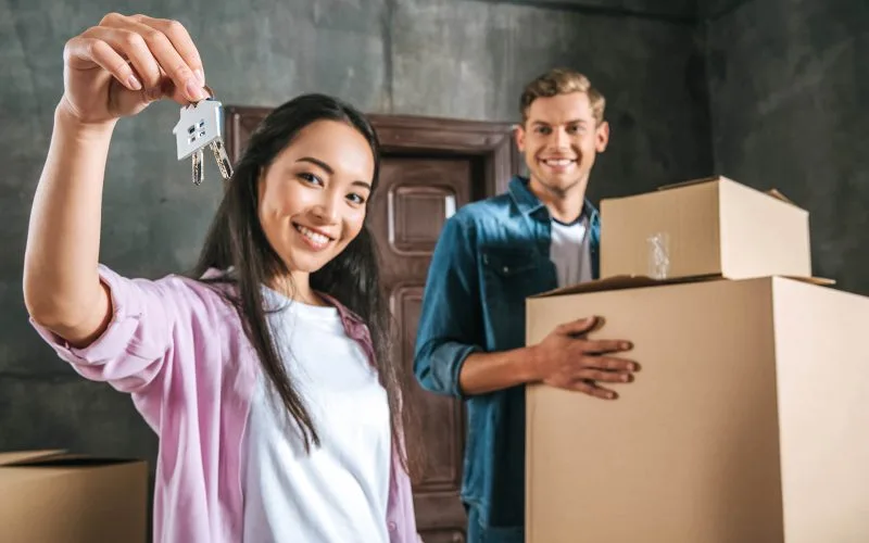 happy workers are loading the objects with professional labor supply serivices dubai provided by Faizan Movers | Storage Facility near you | storage units in dubai